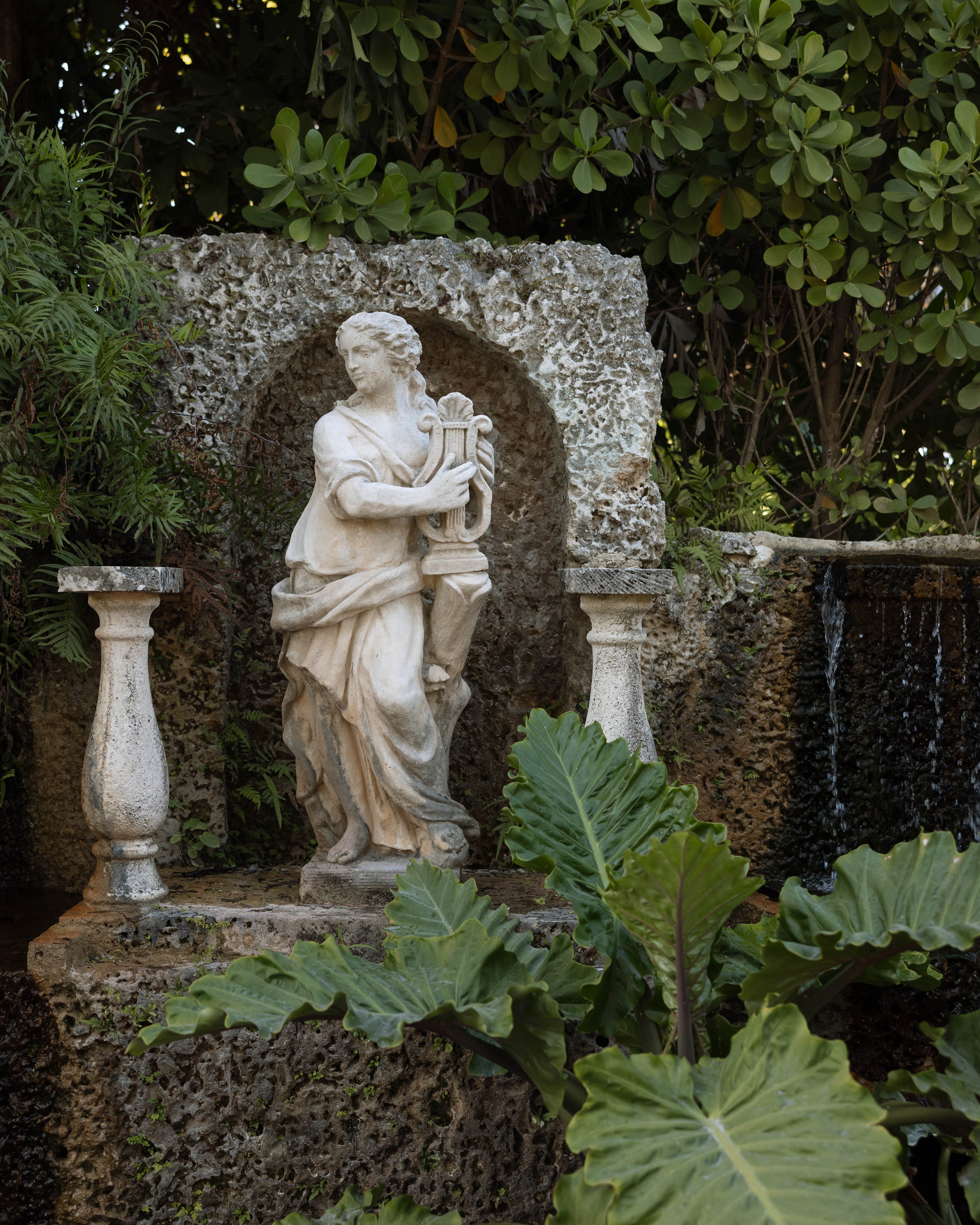 Classical statue in the garden grotto