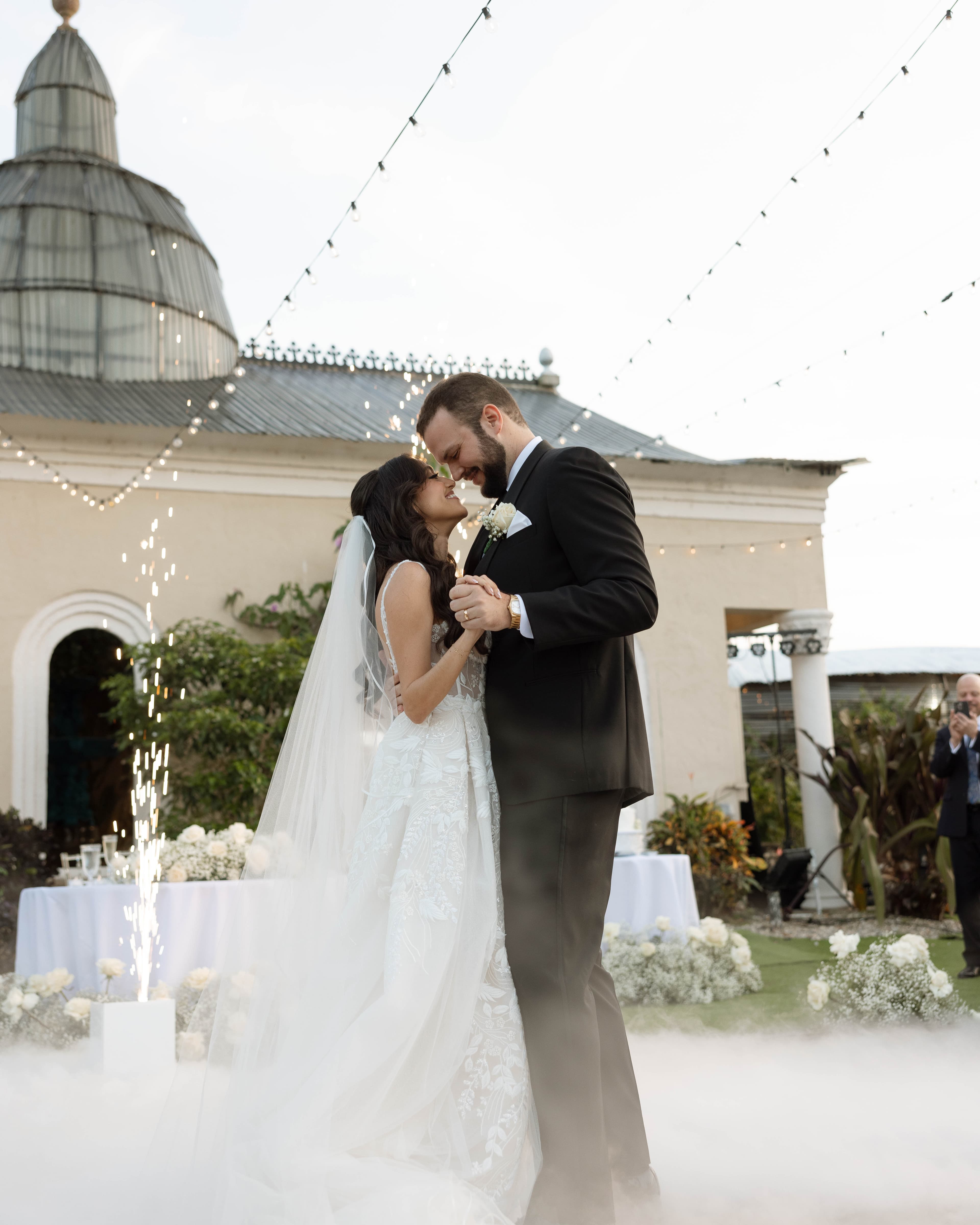 First dance beneath the cupola with fog and sparklers