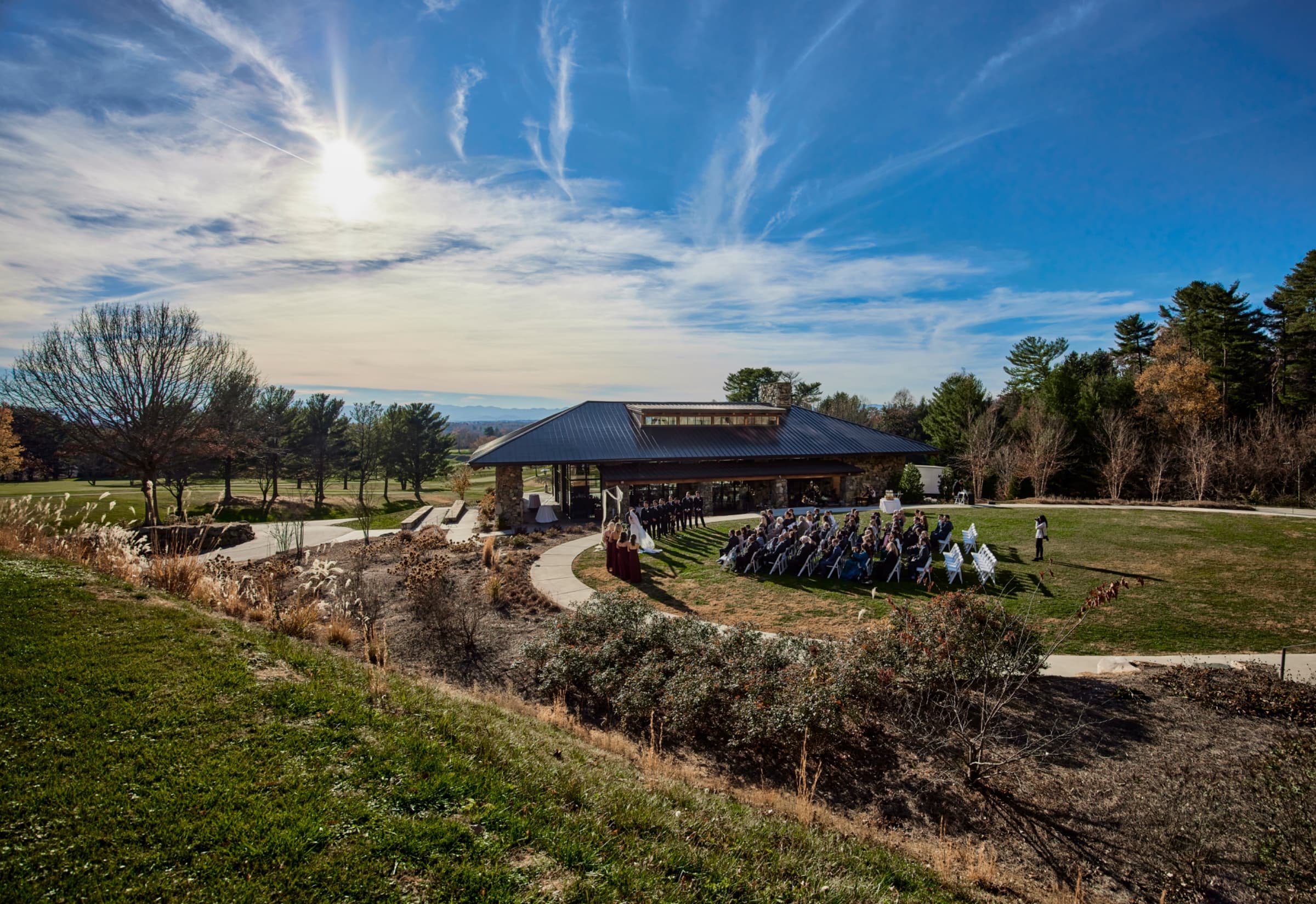 Ceremony at the stone pavilion with the Blue Ridge on the horizon — The Omni Grove Park Inn
