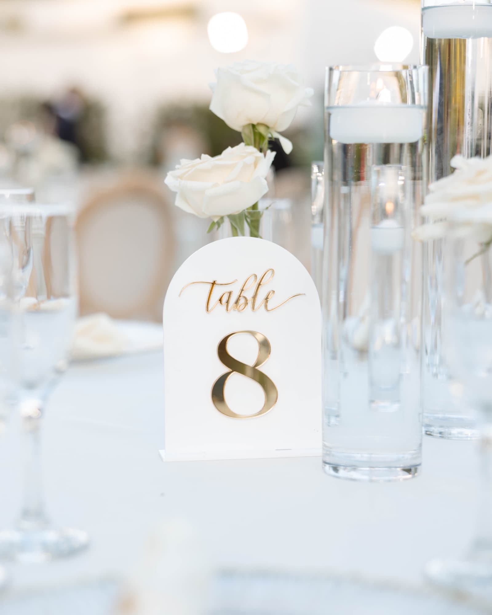 The table eight marker among tapered candles — The Glass Venue wedding venue, Miami, Florida